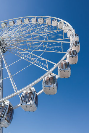 White Ferris wheel with enclosed gondolas in San Franciscoの写真素材