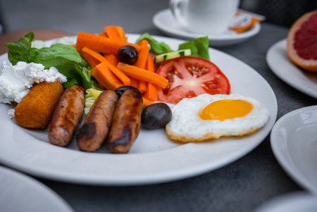 Close up breakfast plate at outdoor cafe table in Mellieha, Maltaの写真素材