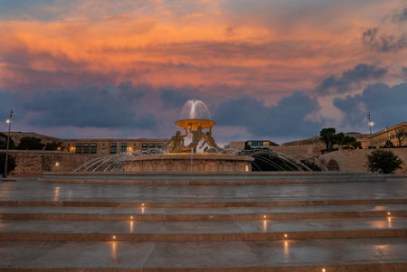 Twilight view of Triton Fountain at Valletta City Gate, Maltaの写真素材