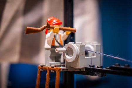 pirate minifigure aims musket beside gray deck cannon, Maltaの写真素材