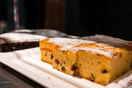 Close up trays of raisin sponge and chocolate cake in Melliehaの写真素材
