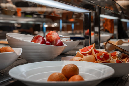 Buffet counter with fresh fruit bowls in Mellieha, Malta hotelの写真素材