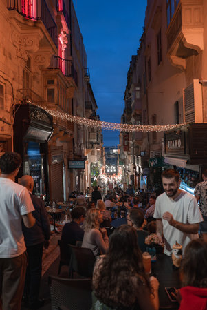Valletta stepped street dining at blue hour with baroque facadesの写真素材