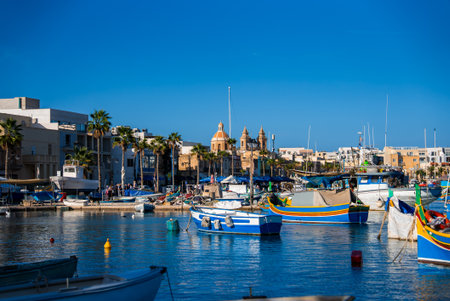 Marsaxlokk harbor with luzzu boats and Pompei Parish Churchの写真素材