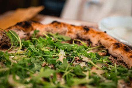 Neapolitan style pizza close up in Valletta with arugula and mushroomsの写真素材