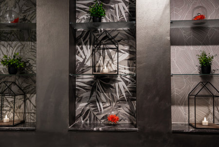 Contemporary niches with lanterns and plants in Mellieha hotel wall