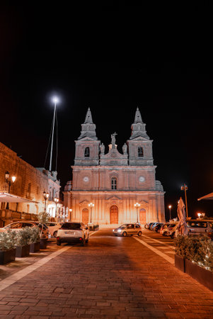 Parish Church of Mellieha at night on a cobblestone street in Maltaの写真素材