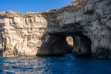Limestone sea arch at Comino Island near the Blue Lagoon, Maltaの写真素材