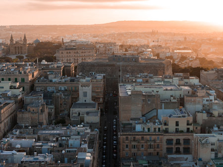 Aerial sunset over Valletta, Malta with bastion walls and baroque domesの写真素材