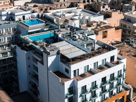 Aerial view of white hotel with rooftop pools in Mellieha, Maltaの写真素材