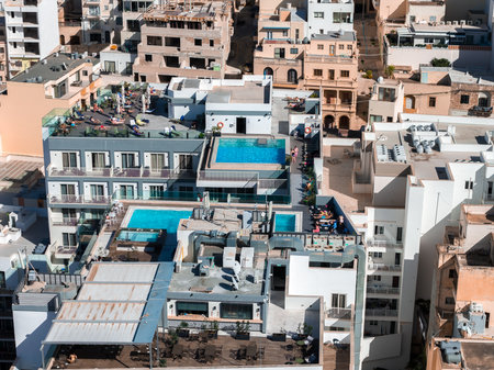 Aerial view of Mellieha Malta with multi level rooftop pool hotelの写真素材