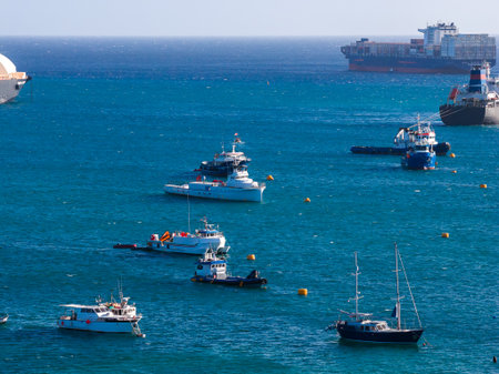 Aerial view of Marsaxlokk harbor with fishing boats and cargo ships