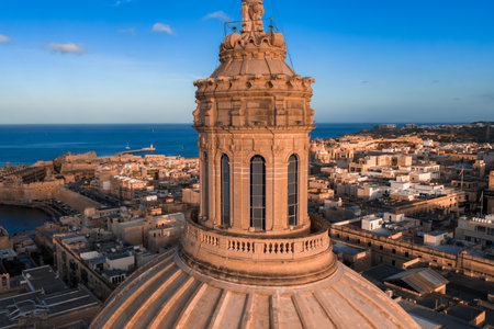 Aerial golden hour view of Valletta with Mount Carmel dome and harborの写真素材