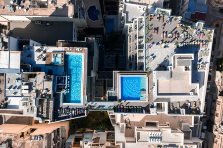 Aerial view of rooftop pools and terraces in Mellieha, Malta