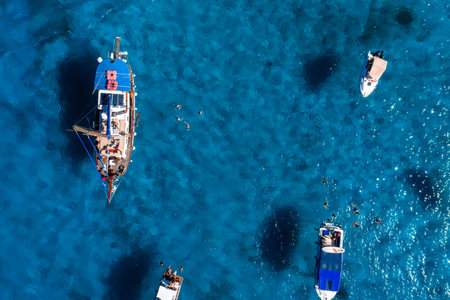 Aerial boats and swimmers at Blue Lagoon, Comino Island, Maltaの写真素材