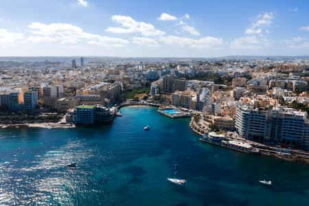 Aerial panorama of Sliema coastline, Malta with lido pool and bayの写真素材