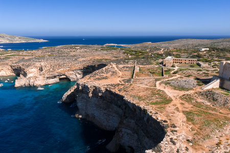 Aerial panorama of Comino cliffs and Blue Lagoon, Malta at middayの写真素材
