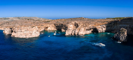 Aerial view of Comino Island cliffs and Blue Lagoon, Malta coastの写真素材