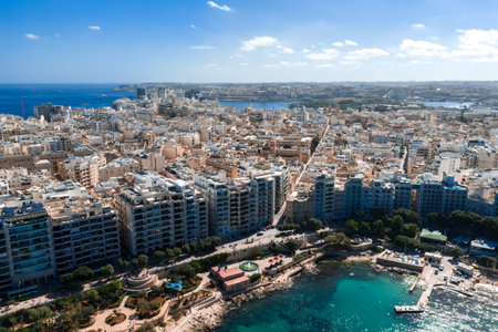 Aerial panorama of Sliema, Malta, limestone grid and turquoise bayの写真素材