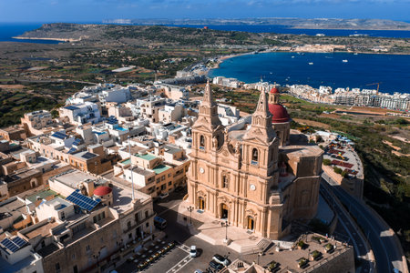 Aerial panoramic view of Mellieha with parish church and bayの写真素材