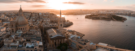 Aerial dusk view of Valletta, Malta, with basilica dome and spireの写真素材