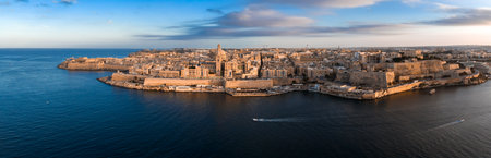 Aerial sunset panorama of Valletta, Malta with basilica dome and spireの写真素材
