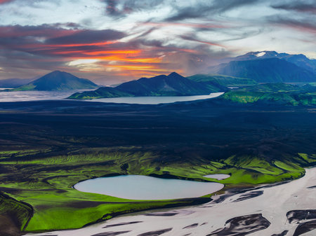 Aerial sunset view of Landmannalaugar rivers, lakes, and rhyolite peaksの写真素材