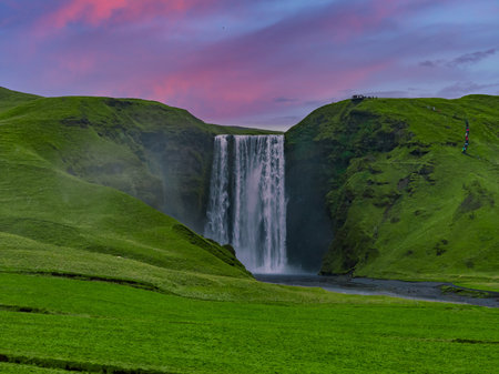 Waterfall resembling Skogafoss at dusk in southern Icelandの写真素材