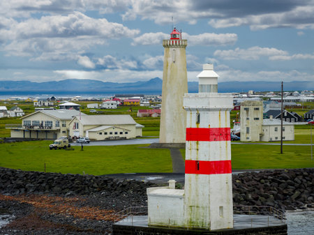 Twin lighthouses of Akranes stand over a compact harbor landscapeの写真素材