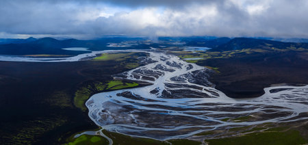 Aerial braided glacial river across volcanic plains in Iceland