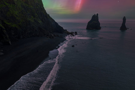 Aerial twilight over Reynisfjara and Reynisdrangar near Vik, Icelandの写真素材