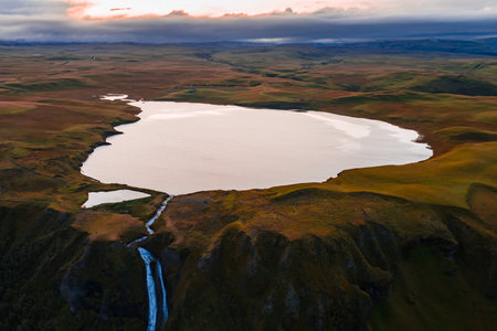 Aerial lake and waterfall in Iceland near Landmannalaugar canyonの写真素材