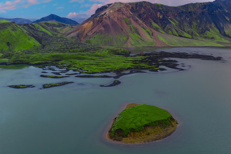 Aerial islet in placid lake near Landmannalaugar, Iceland Highlandsの写真素材