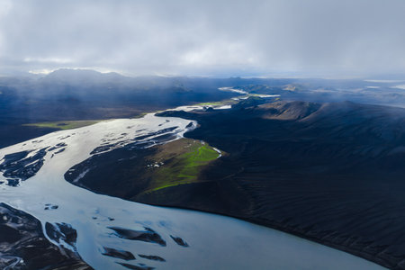 Aerial of braided glacial river and moss island in Iceland highlandsの写真素材