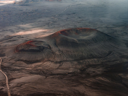 Aerial view of twin ash dusted volcanic craters in Iceland highlands