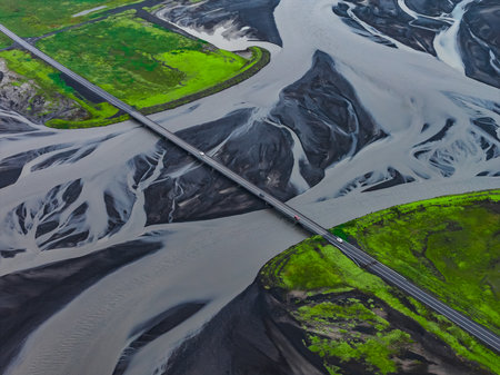 Aerial long bridge over braided glacial river near Vik, Icelandの写真素材