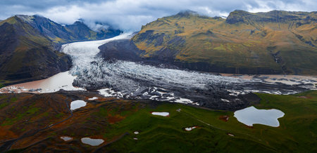 Aerial view of glacier tongue and lagoon in Icelands Vatnajokullの写真素材