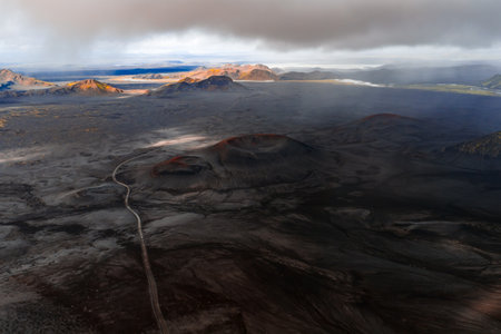 Aerial volcanic plain in Iceland with road and red craters, Landmannalaugarの写真素材