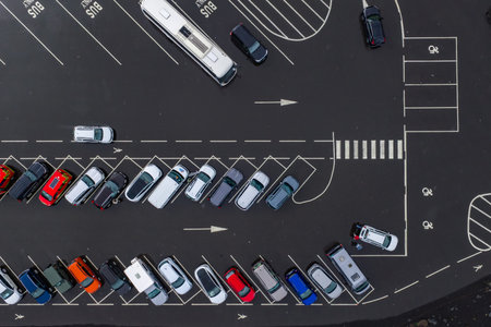 Aerial top down view of Iceland parking lot with buses and cars
