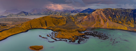 Aerial volcanic lake with rhyolite peaks in Icelands Highland regionの写真素材