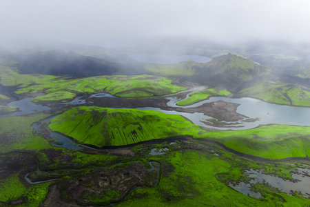 Aerial moss green hills and braided rivers in Iceland Highlandsの写真素材