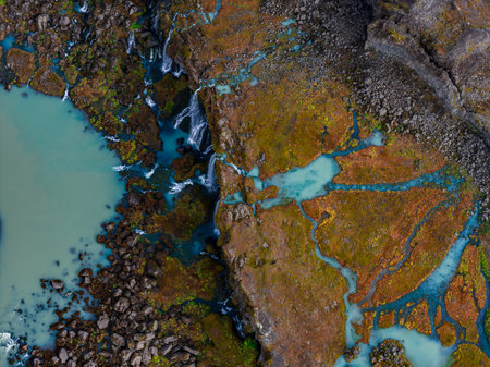 Aerial braided glacial streams over volcanic tundra in Iceland
