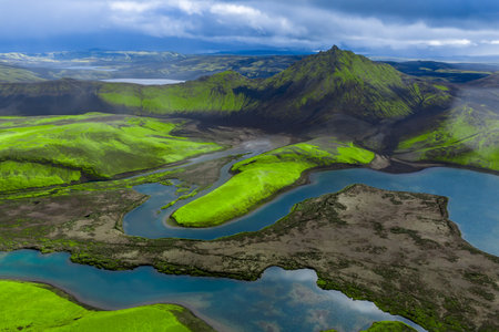 Aerial of Iceland highlands with conical peak and braided riversの写真素材