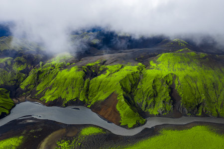 Aerial glacial river through volcanic sands and moss in Icelandの写真素材