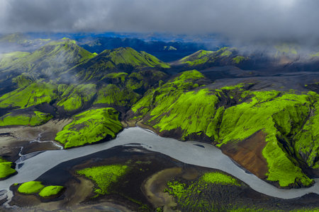 Aerial view of mossy volcanic mountains and rivers in Iceland highlandsの写真素材