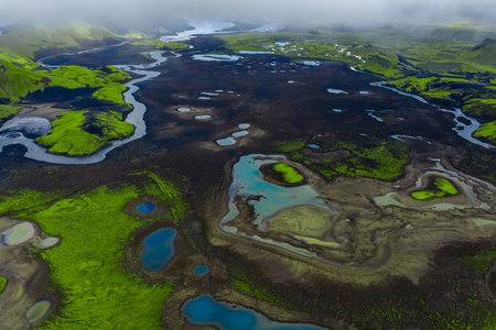 Aerial volcanic highlands of Iceland with rivers and mossy ridgesの写真素材
