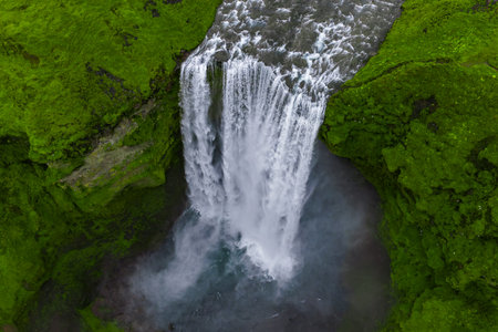 Aerial view of Skogafoss waterfall in southern Iceland cliffsの写真素材