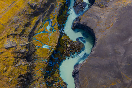 Aerial glacial river through volcanic highlands near Landmannalaugarの写真素材