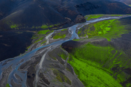 Aerial braided glacial rivers over mossy lava fields in Icelandの写真素材