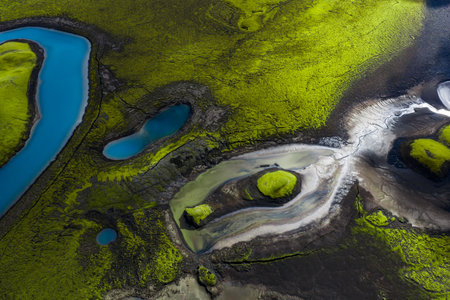 Aerial Icelandic highlands with moss fields, ash, and turquoise lakesの写真素材